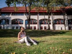 Student sitting on the grass
